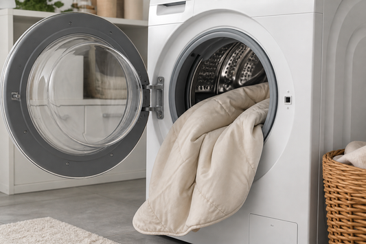 Neutral comforter loosely placed in a front-loading washing machine before the wash cycle